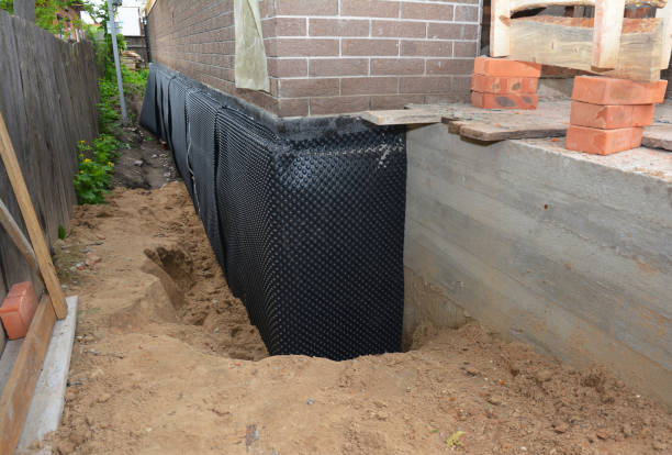 Happy homeowners after waterproofing job in Andersonville